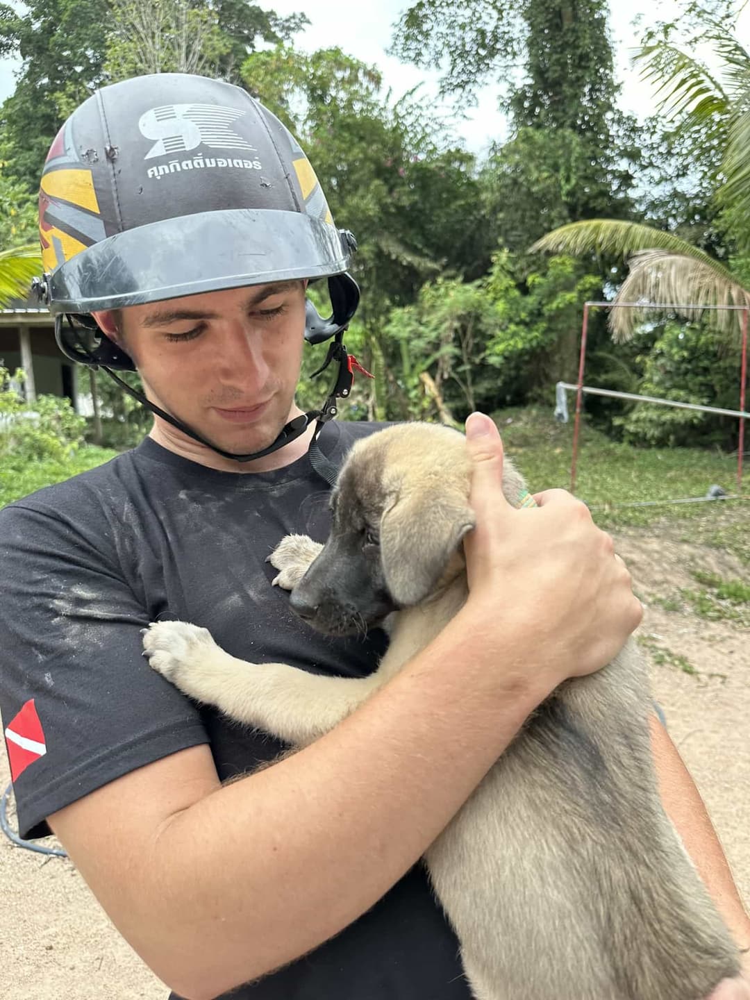 Curtis holding puppy